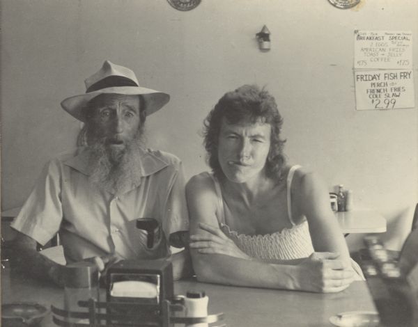 1982 - Pair sits at diner counter